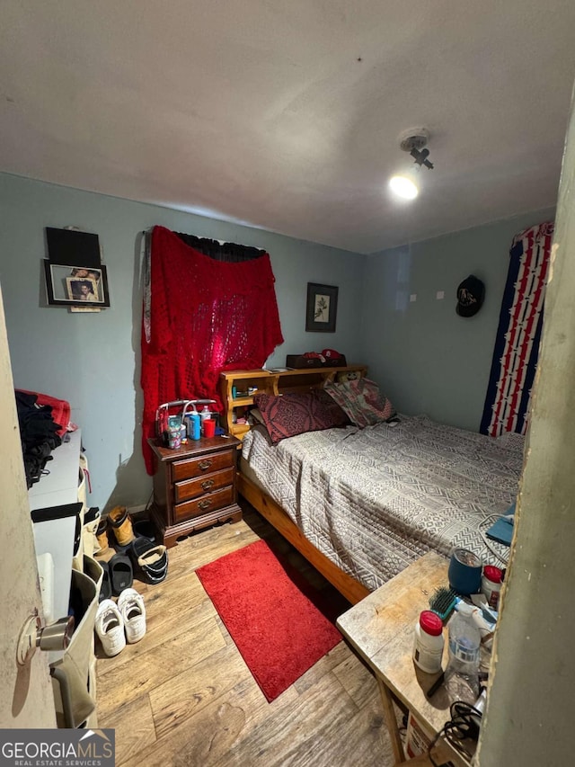 bedroom with light hardwood / wood-style floors