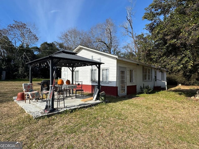 exterior space with a gazebo, a lawn, and a patio