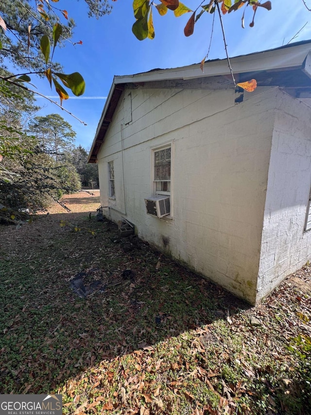 view of side of property featuring cooling unit