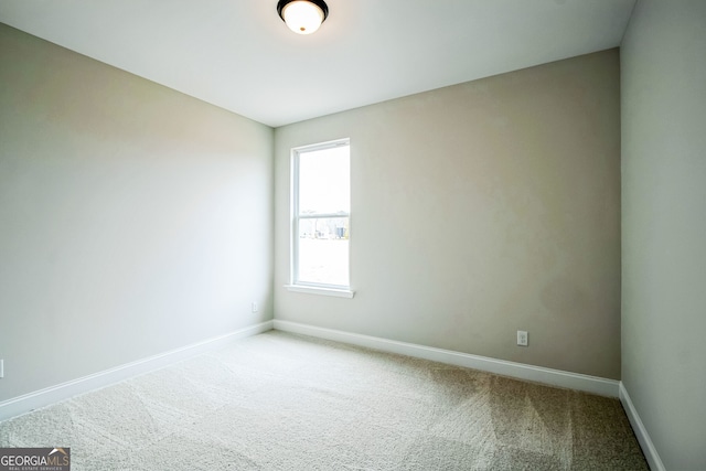 spare room with light carpet