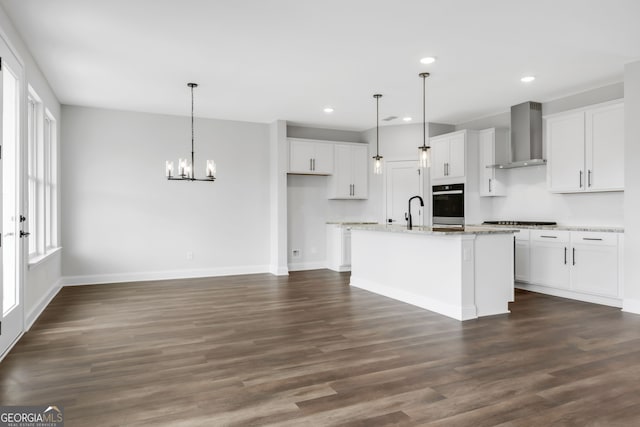 39 Pecan Ct, Hoschton, GA 30548 - kitchen with wall chimney exhaust hood, white cabinetry, baseboards, recessed lighting, and gas stovetop