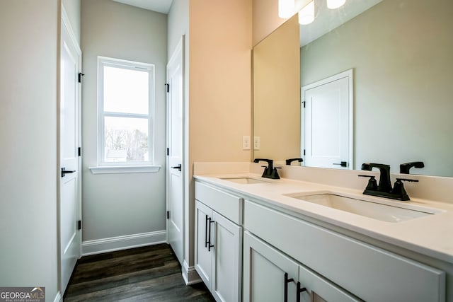 bathroom with vanity and hardwood / wood-style floors