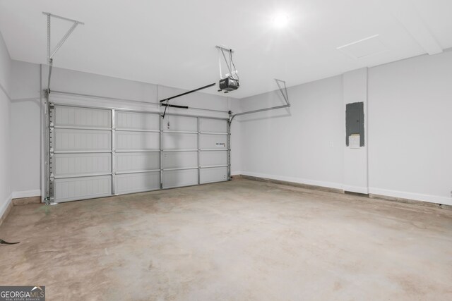 39 Pecan Ct, Hoschton, GA 30548 - garage with a garage door opener, electric panel, and baseboards