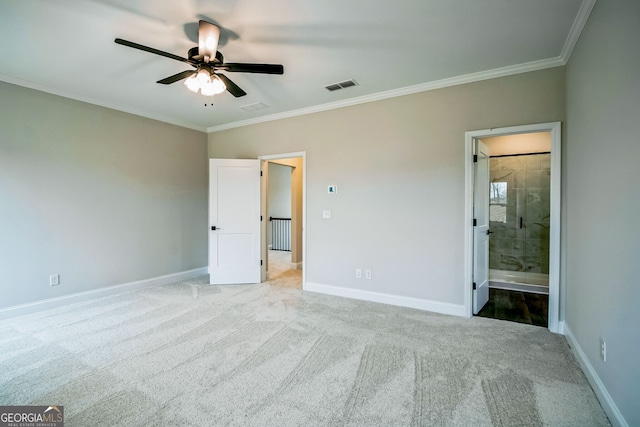 unfurnished bedroom featuring light carpet, ornamental molding, ceiling fan, and ensuite bathroom