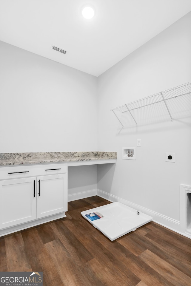 39 Pecan Ct, Hoschton, GA 30548 - washroom with hookup for a washing machine, dark wood-type flooring, hookup for an electric dryer, baseboards, and cabinet space