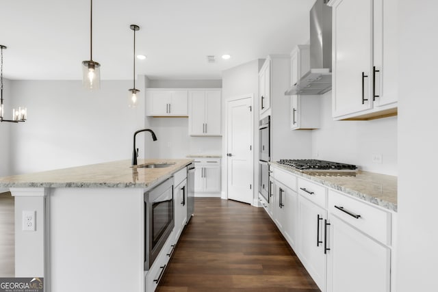 39 Pecan Ct, Hoschton, GA 30548 - kitchen with a sink, wall chimney exhaust hood, appliances with stainless steel finishes, dark wood-style flooring, and white cabinetry