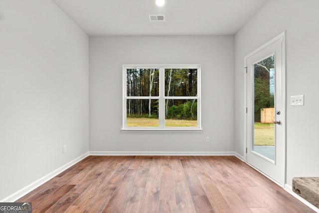 spare room with light wood-type flooring