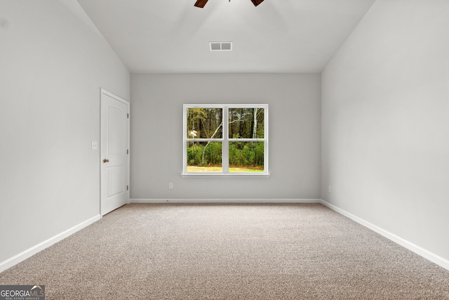 spare room featuring carpet floors and ceiling fan