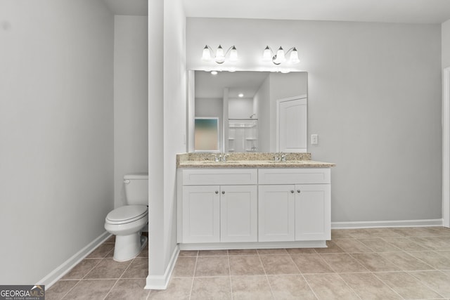 bathroom featuring walk in shower, vanity, toilet, and tile patterned flooring