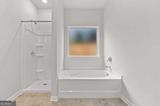 bathroom featuring separate shower and tub and tile patterned flooring