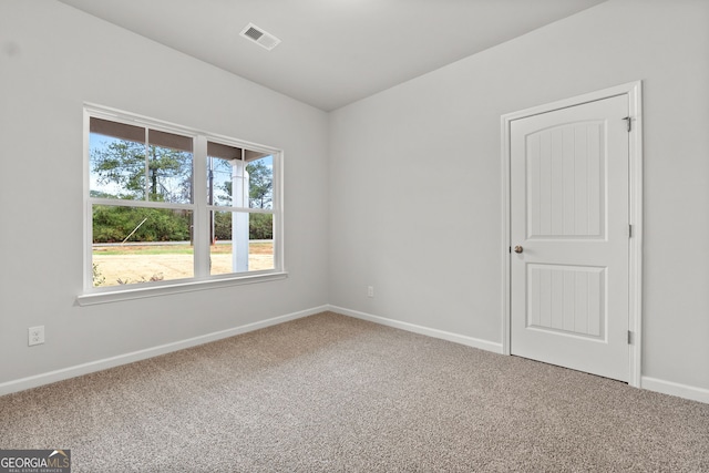 unfurnished room featuring carpet flooring