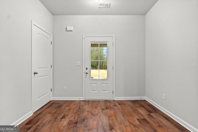 entryway with dark wood-type flooring