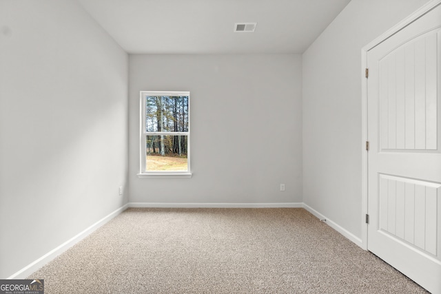 spare room featuring carpet floors