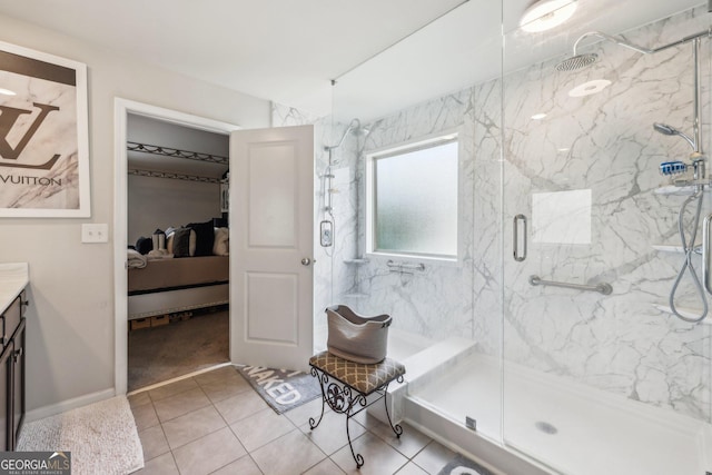 bathroom with vanity, tile patterned flooring, and walk in shower