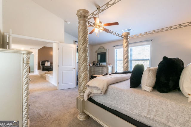 bedroom featuring ceiling fan, vaulted ceiling, and light carpet