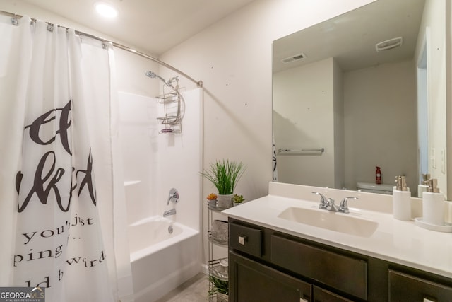 full bathroom with shower / bathtub combination with curtain, vanity, and toilet