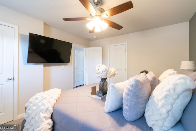 carpeted bedroom featuring ceiling fan