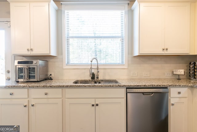 kitchen featuring white cabinetry, stainless steel dishwasher, and sink