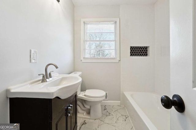 6467 Joanna St, Lithia Springs, GA 30122 - bathroom with marble look tiles, toilet, and vanity