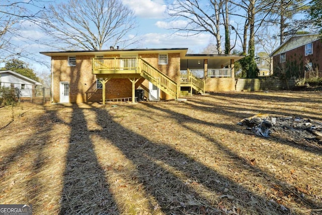 back of house with a wooden deck and central air condition unit