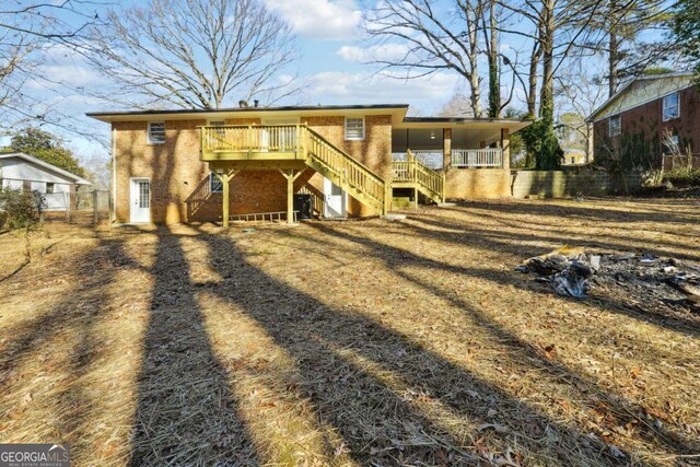 6467 Joanna St, Lithia Springs, GA 30122 - rear view of property with stairs and fence