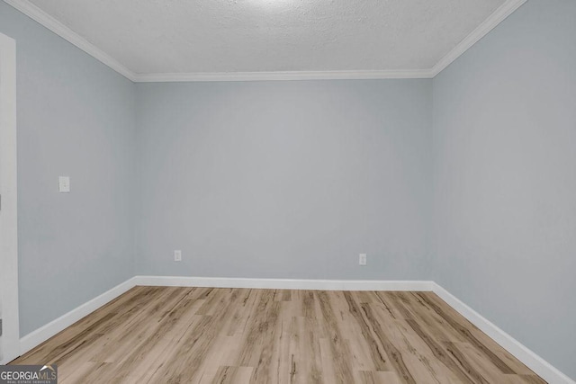 6467 Joanna St, Lithia Springs, GA 30122 - spare room with wood finished floors, crown molding, and a textured ceiling