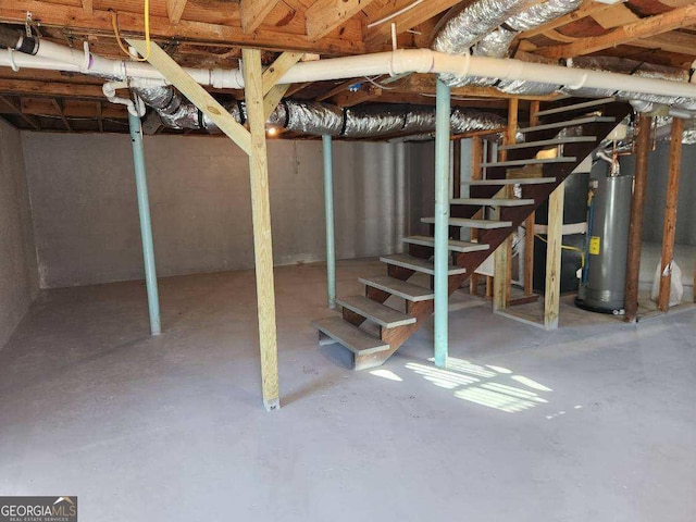 6467 Joanna St, Lithia Springs, GA 30122 - unfinished basement with water heater and stairs