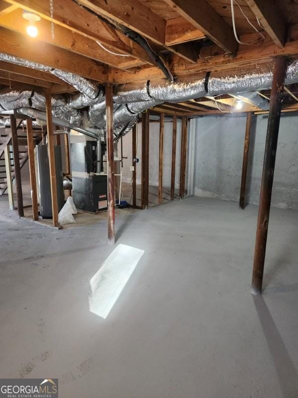 6467 Joanna St, Lithia Springs, GA 30122 - unfinished basement featuring water heater