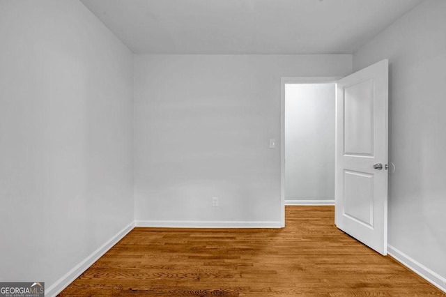 6467 Joanna St, Lithia Springs, GA 30122 - empty room with baseboards and wood finished floors