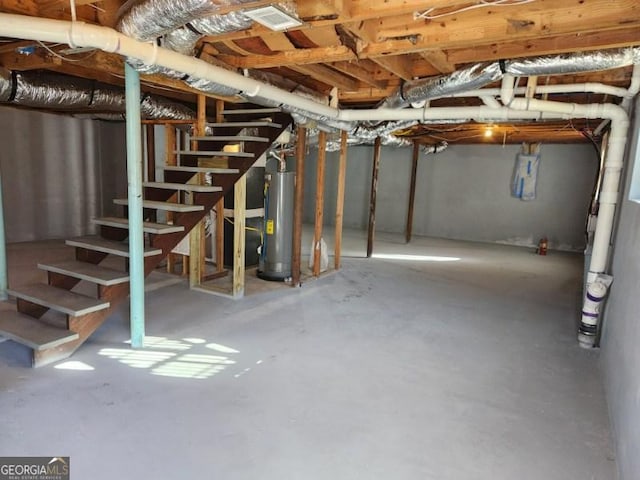 6467 Joanna St, Lithia Springs, GA 30122 - unfinished below grade area with water heater and stairs