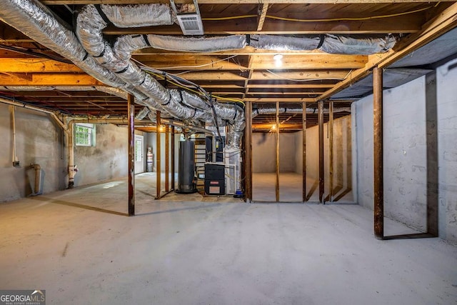 6467 Joanna St, Lithia Springs, GA 30122 - below grade area featuring water heater and heating unit