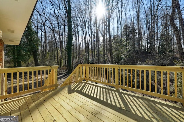 6467 Joanna St, Lithia Springs, GA 30122 - wooden terrace featuring view of wooded area