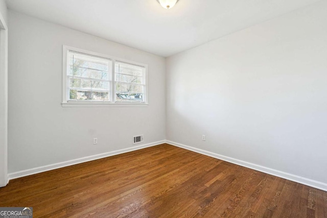 empty room featuring hardwood / wood-style floors