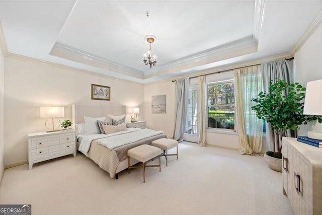 bedroom featuring crown molding, a notable chandelier, a tray ceiling, and light colored carpet