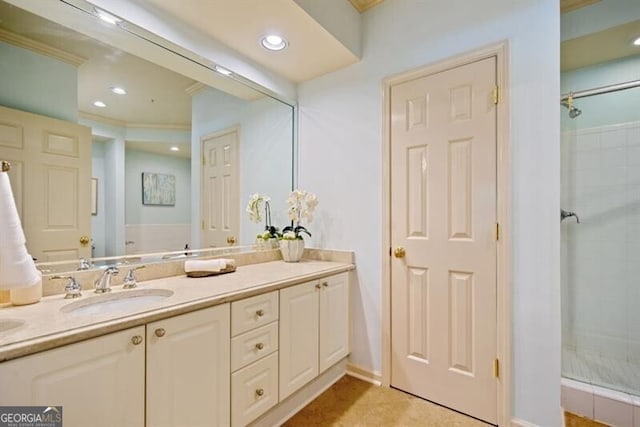 bathroom featuring crown molding, vanity, and a shower with shower door