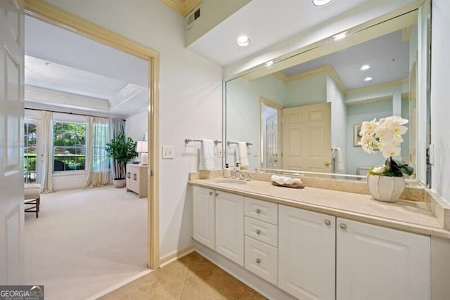 bathroom with tile patterned floors, ornamental molding, and vanity