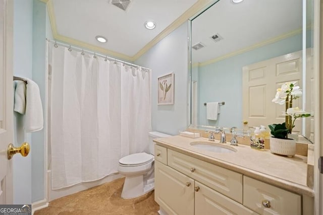 bathroom featuring vanity, crown molding, and toilet