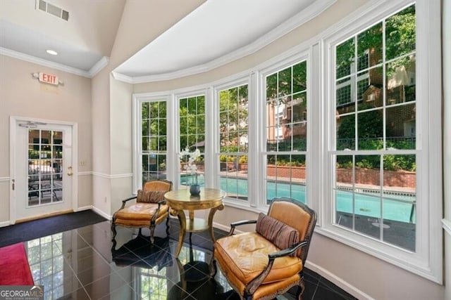 sunroom / solarium featuring lofted ceiling