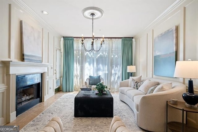 living room with a premium fireplace, an inviting chandelier, and crown molding