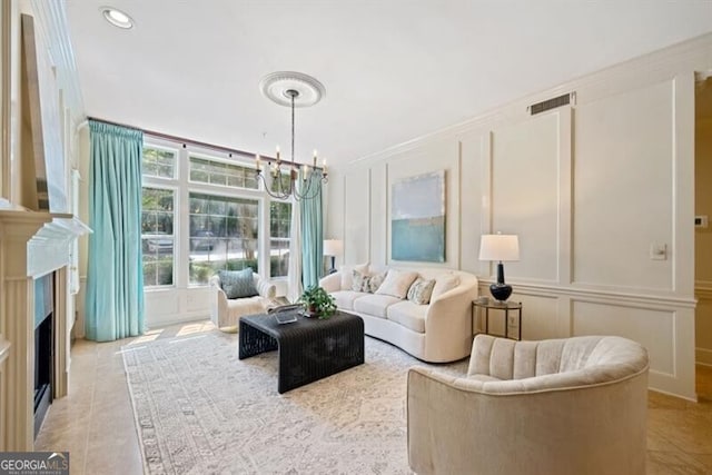 living room featuring light tile patterned floors and an inviting chandelier