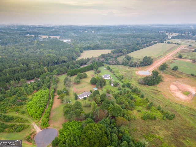 birds eye view of property with a rural view