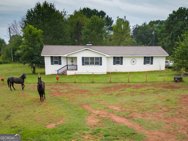 ranch-style home with a front yard