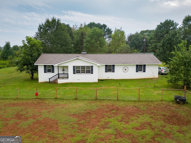 ranch-style house featuring a front lawn