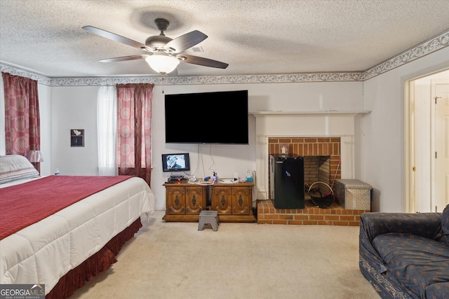 carpeted bedroom with ceiling fan, a fireplace, and a textured ceiling