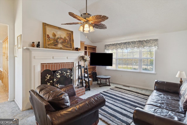 carpeted living room with ceiling fan, lofted ceiling, and a fireplace