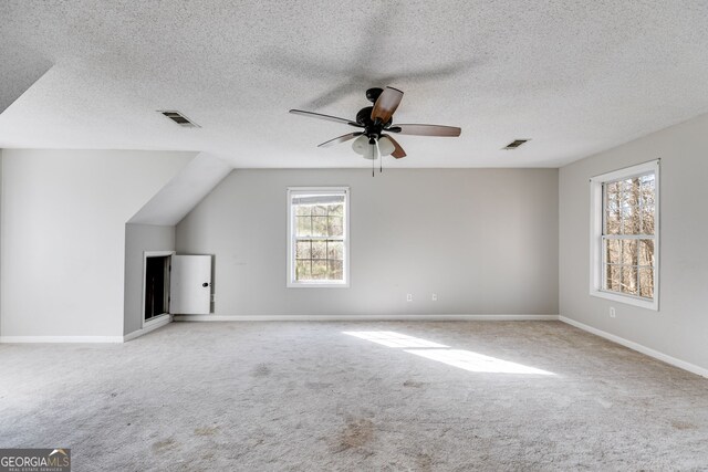 clothes washing area featuring light colored carpet and hookup for an electric dryer