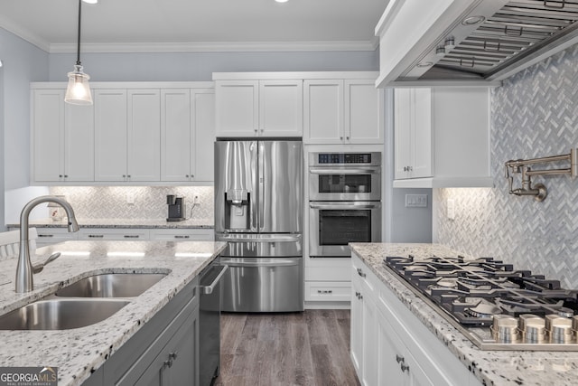 kitchen with sink, crown molding, appliances with stainless steel finishes, white cabinets, and custom exhaust hood