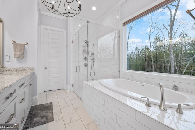 bathroom featuring plus walk in shower, ornamental molding, a wealth of natural light, and vanity