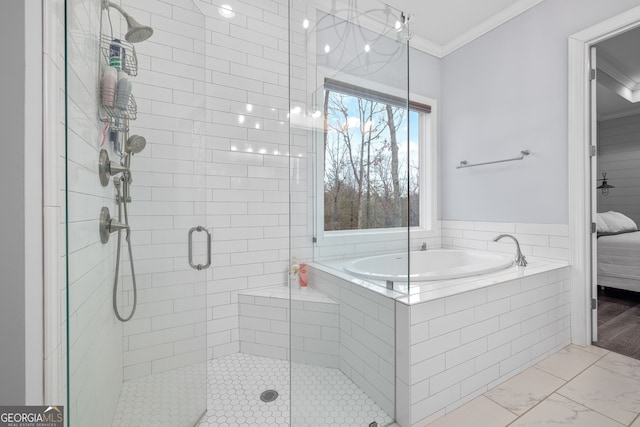 bathroom featuring crown molding and shower with separate bathtub