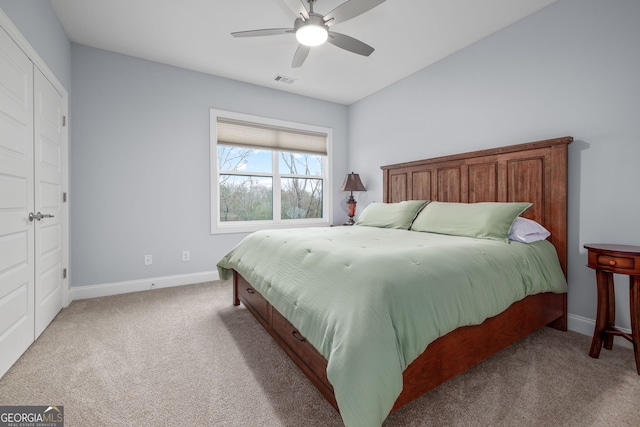 bedroom featuring light carpet and ceiling fan